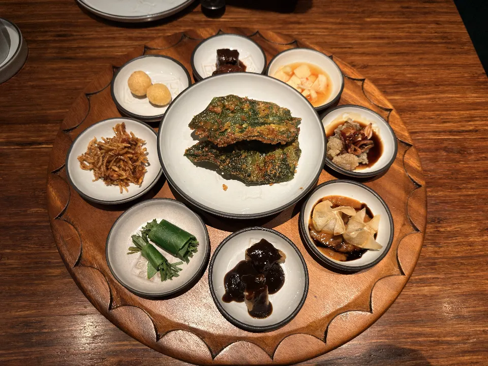 A round tray of small Indonesian dishes at Nusantara by Locavore.